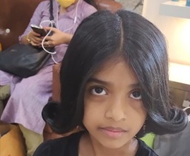 Modern haircut for young girl by professional stylist