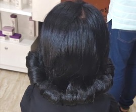 Modern haircut for young girl by professional stylist