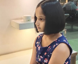 Young girl getting a stylish haircut at the salon